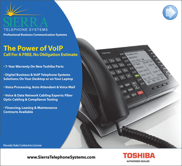 Sierra Telephone Systems, Inc. phones on display around computer
